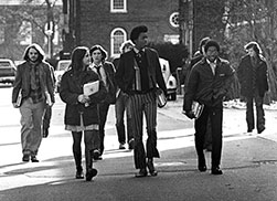 Photo of students walking through campus. Link to Life Stage Gift Planner Over Age 65 Situations.