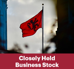 The school flag. Closely Held Business Stock Rollover